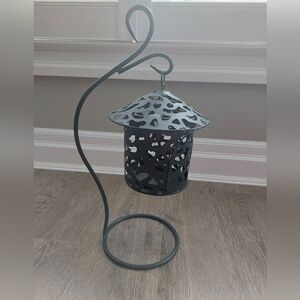 Indoor outdoor black metal lantern candle holder.
